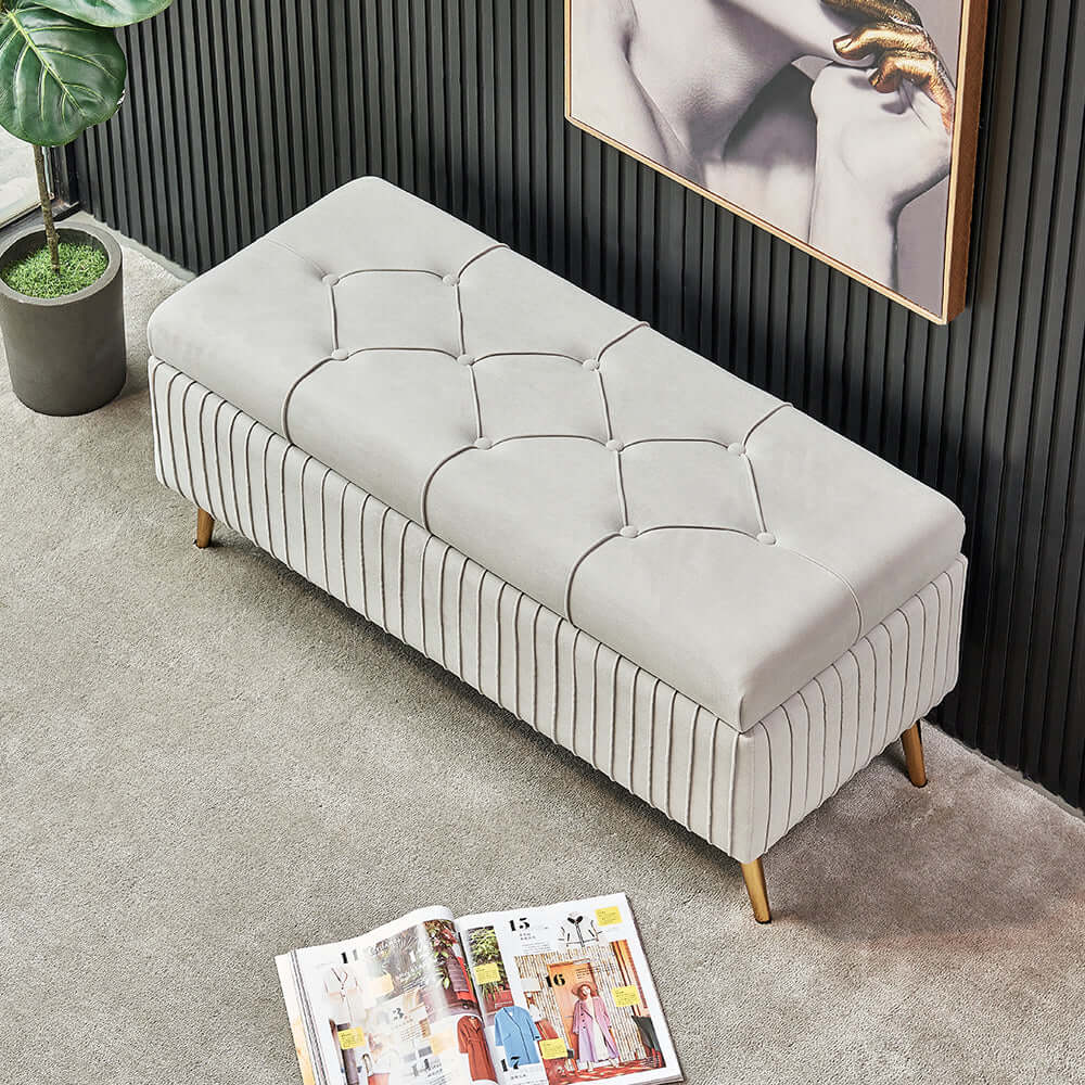 Modern gray velvet storage bench with gold legs for elegant decor