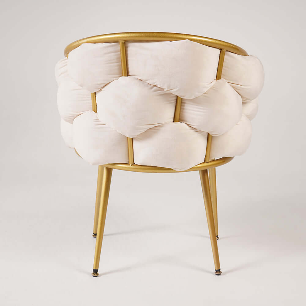 Plush beige velvet armchair with sleek gold legs for comfortable and elegant seating