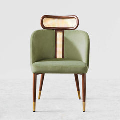 Modern green velvet dining chair with curved back design for comfortable seating