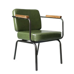 Vintage green upholstered dining chairs with metal armrests