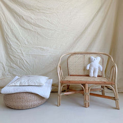 Toddler's woven cane settee with cushion for indoors