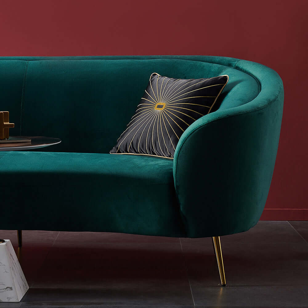 Modern deep green sofa with metallic legs, perfect for enhancing stylish home interiors