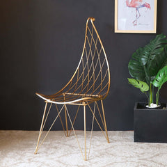 Luxurious gold finish dining chair with hollow metal structure and soft PU leather cushion