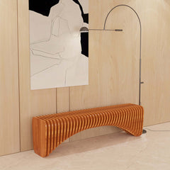 Natural wood curved bench with linear surface