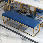 Modern blue velvet bench with gold metal frame, luxurious and elegant seating for bedroom or living room