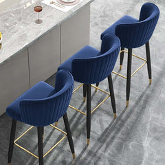 Comfortable blue velvet counter height bar stool with tufted design