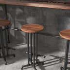 Stylish and functional black bar stool with footrest, crafted from solid wood for a modern industrial look