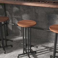 Stylish and functional black bar stool with footrest, crafted from solid wood for a modern industrial look