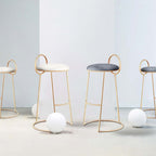 Chic gray velvet low back counter height barstool with luxurious gold legs for modern interiors