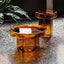 Cloud-shaped modern glass coffee table set with two pieces in vibrant orange, green, purple, and black main product image