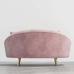 63 inch pink velvet curved sofa with gold metal frame and matching toss pillow, modern style