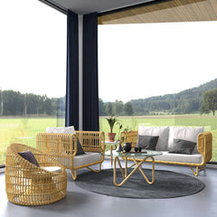 Outdoor conversation set with yellow cushions and glass top table