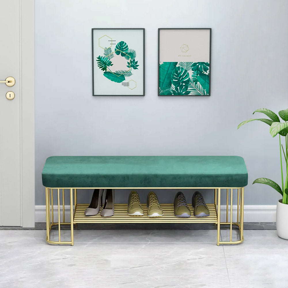 Modern green velvet upholstered storage bench with golden frame and shelves