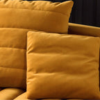 Yellow velvet upholstered sofa with comfortable seating for 3 people in luxury design