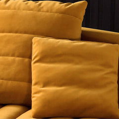 Yellow velvet upholstered sofa with comfortable seating for 3 people in luxury design