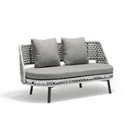 5-piece rattan patio furniture ensemble featuring rotating armchair and round end table