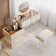 Elegant white makeup vanity with acrylic stool, drawers, and extendable mirror