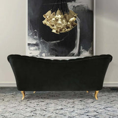 Channel tufted 3 seater sofa in black velvet upholstery with gold accents