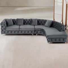 Curved gray velvet upholstered LShaped chesterfield sofa for stylish living rooms