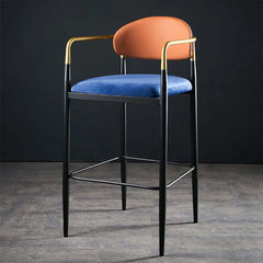 Orange velvet upholstered gold bar stool with mid-century design