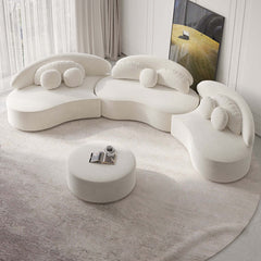 Contemporary 7-seat beige velvet upholstered sofa with round sectional design, ottoman, and pillows