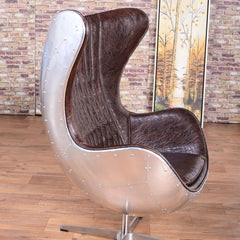 Sleek brown & silver office chair upholstered in leather, swivels and has a wing back for added elegance