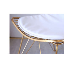 Elegant gold finish dining chair with hollow metal frame and stylish PU leather cushion