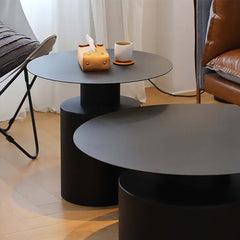 Modern white round coffee tables with metal base, perfect for small gatherings