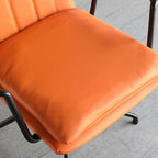 Contemporary armchair in bright orange color for productive home study