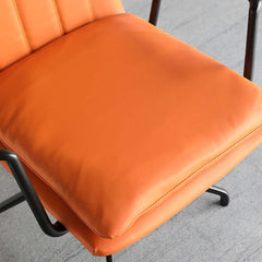 Contemporary armchair in bright orange color for productive home study