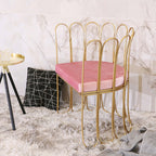 Pink velvet upholstered accent chair with luxurious gold legs