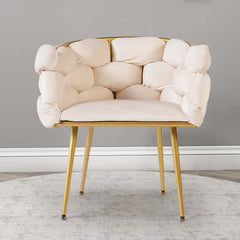 Elegant upholstered beige accent chair with gold legs and padded armrests