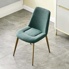 Pair of modern green linen dining room chairs offering plush comfort and trendy style