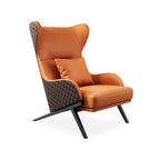 Luxurious faux leather wingback lounge chair with sturdy gold trestle base