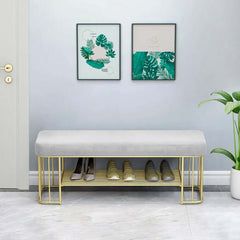 Trendy green velvet upholstered bench for entryway with modern golden frame and shelves