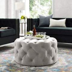 Modern small round pouf in light gray velvet cocktail ottoman