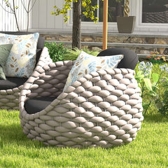 Sleek modern armchair crafted with gray woven textilene rope and removable cushion for outdoor comfort