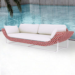 Wide modern aluminum and rattan outdoor patio sofa in white and orange with cushions