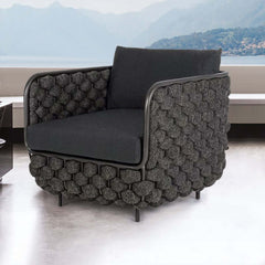 Outdoor patio sofa with cushion in gray, featuring modern aluminum and rope construction