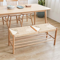 Contemporary rattan dining room bench with wooden legs for a modern look and feel