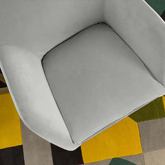 Contemporary gray velvet armchair with gold legs and included pillow