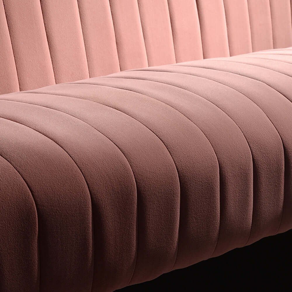 Elegant 2-seater sofa in pink velvet upholstery with luxurious channel tufting