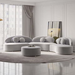 Modern round sectional 7-seat sofa set in beige velvet upholstery with ottoman and decorative pillows