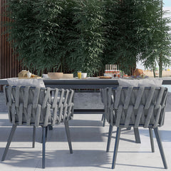 Outdoor dining set with extendable ceramic table and woven aluminum armchairs, 7 pieces
