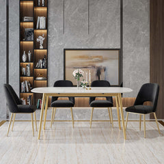 Pair of stylish black upholstered dining chairs with hollow back and metallic gold legs