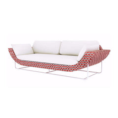 Sleek white and orange outdoor patio sofa with aluminum and rattan construction