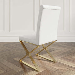 Two modern black leather dining chairs with gold legs - sleek and sophisticated seating option