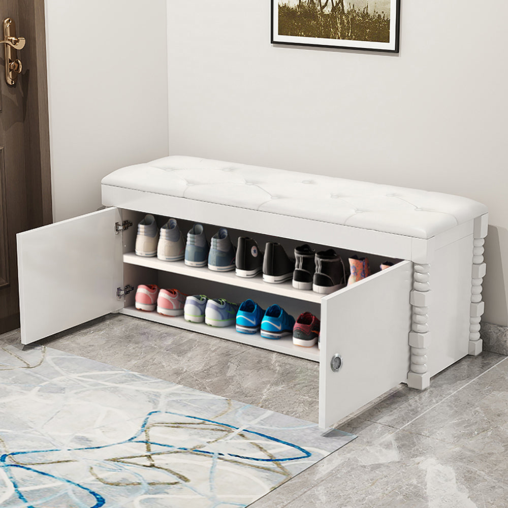 White entryway bench with shoe storage and leather upholstered seat