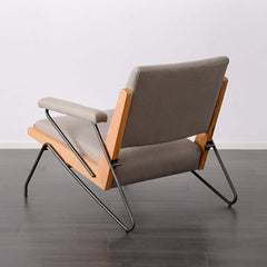 Contemporary beige arm chair featuring upholstered cotton and linen with black carbon steel