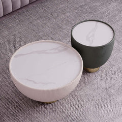 Versatile gray drum coffee table with stone round top and PU leather accent, ideal for modern living spaces